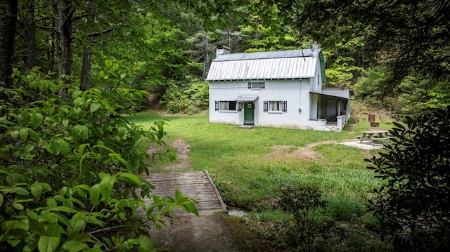 TBD Blue Springs Rd, Elk Creek, VA 24326 - rear view of property featuring a chimney, a yard, a metal roof, and a view of trees
