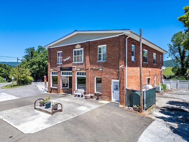 back of house with a patio and central air condition unit