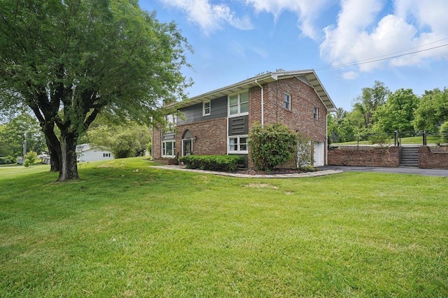 16050 Industrial Park Rd, Bristol, VA 24202 - view of property exterior with an attached garage, brick siding, and driveway
