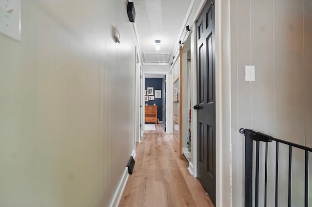 16050 Industrial Park Rd, Bristol, VA 24202 - corridor with light wood-style flooring, a textured ceiling, and attic access