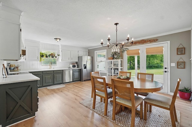 16050 Industrial Park Rd, Bristol, VA 24202 - dining area featuring a chandelier, crown molding, light wood finished floors, and a textured ceiling