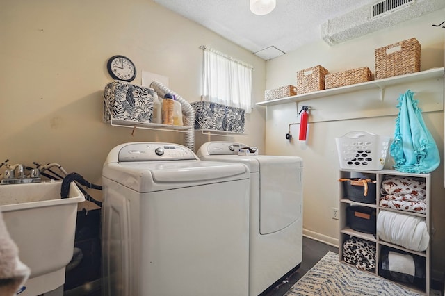 16050 Industrial Park Rd, Bristol, VA 24202 - laundry room featuring separate washer and dryer and a textured ceiling