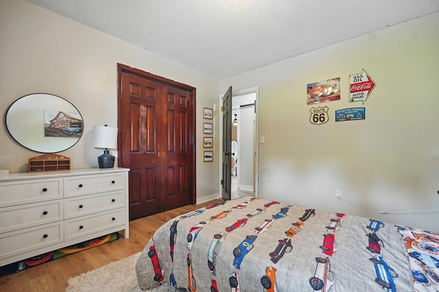 16050 Industrial Park Rd, Bristol, VA 24202 - bedroom featuring light wood-type flooring and a textured ceiling