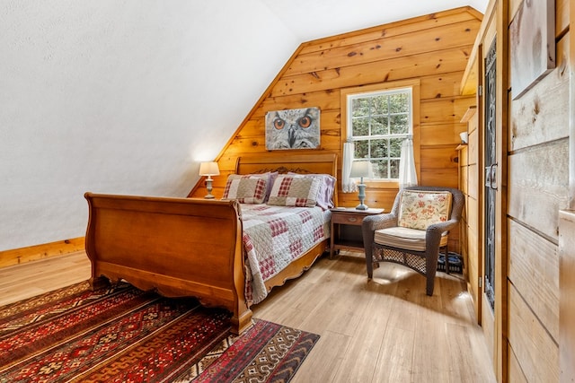 799 Crystal Springs Dr, Fancy Gap, VA 24328 - bedroom featuring wood finished floors, vaulted ceiling, and wood walls