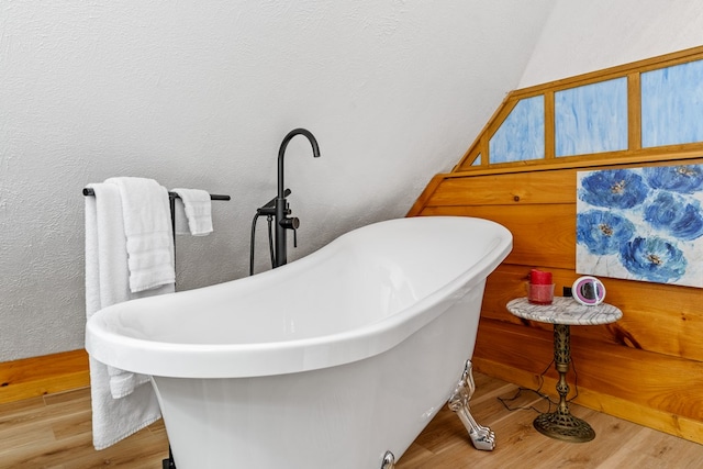 799 Crystal Springs Dr, Fancy Gap, VA 24328 - full bath featuring a textured wall, wood finished floors, and a freestanding bath