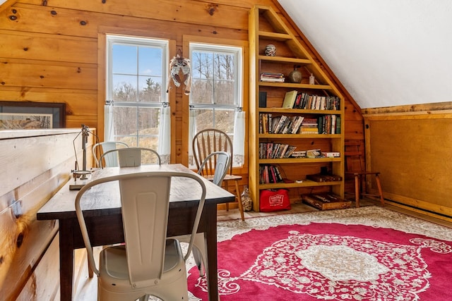 799 Crystal Springs Dr, Fancy Gap, VA 24328 - dining space with wood walls, built in shelves, and vaulted ceiling