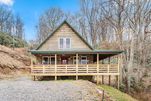 799 Crystal Springs Dr, Fancy Gap, VA 24328 - view of front of house with stone siding, covered porch, and metal roof