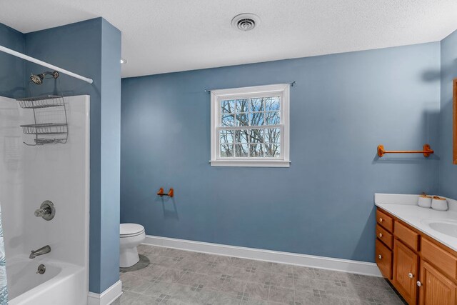 bathroom featuring vanity, baseboards, visible vents, a textured ceiling, and toilet