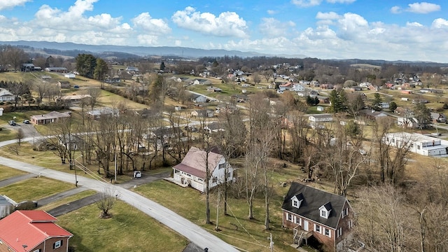 drone / aerial view featuring a mountain view and a residential view