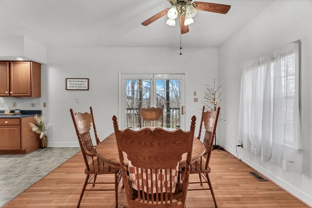 dining space featuring visible vents, a healthy amount of sunlight, and light wood-type flooring