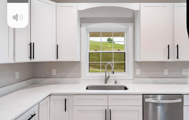 679 Hillman Hwy, Glade Spring, VA 24340 - kitchen featuring stainless steel dishwasher, a sink, white cabinetry, and light stone countertops