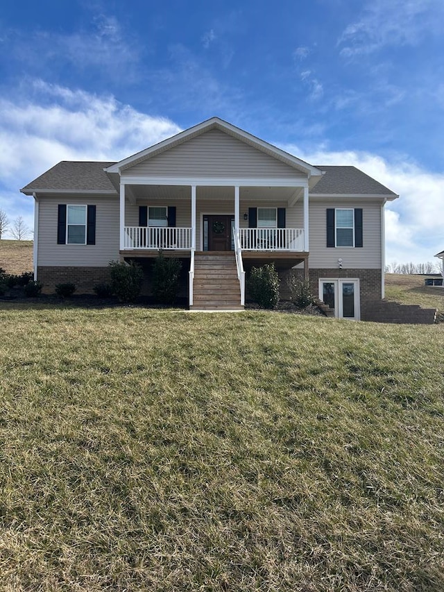 679 Hillman Hwy, Glade Spring, VA 24340 - view of front of property with a front yard, covered porch, brick siding, and a shingled roof