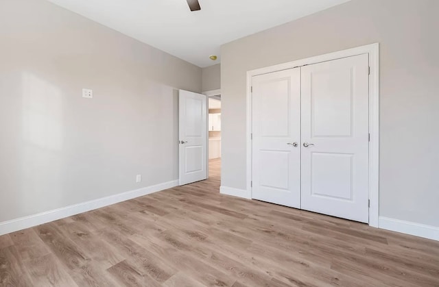 679 Hillman Hwy, Glade Spring, VA 24340 - unfurnished bedroom featuring light wood finished floors, baseboards, a closet, and a ceiling fan