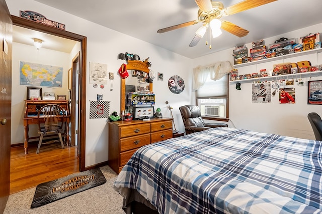 bedroom featuring baseboards, ceiling fan, cooling unit, and carpet
