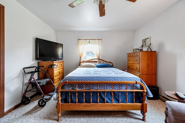 carpeted bedroom with baseboards and ceiling fan
