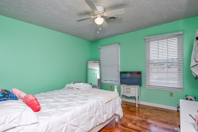 17031 Sedona Dr, Abingdon, VA 24211 - bedroom featuring wood finished floors, a textured ceiling, and ceiling fan