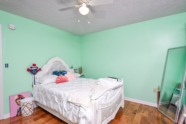 17031 Sedona Dr, Abingdon, VA 24211 - bedroom with wood finished floors, a textured ceiling, and a ceiling fan