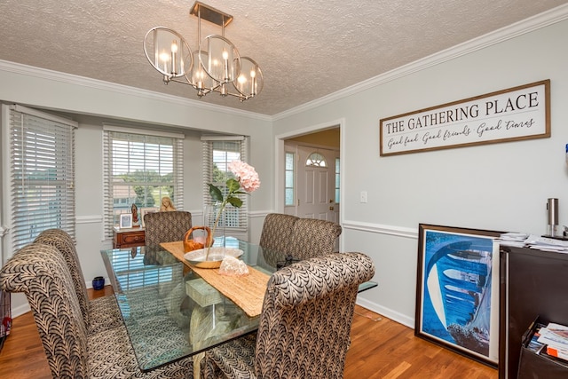17031 Sedona Dr, Abingdon, VA 24211 - dining space with a chandelier, wood finished floors, ornamental molding, and a textured ceiling