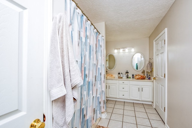 17031 Sedona Dr, Abingdon, VA 24211 - full bath with tile patterned floors, double vanity, and a textured ceiling