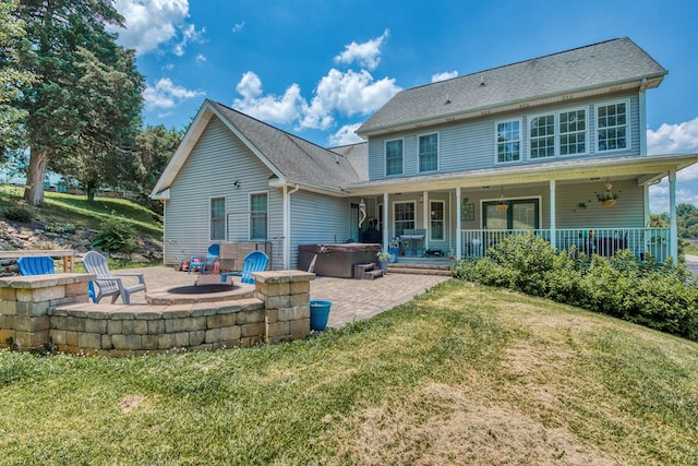 17031 Sedona Dr, Abingdon, VA 24211 - rear view of house featuring a hot tub, a patio, an outdoor fire pit, and a yard
