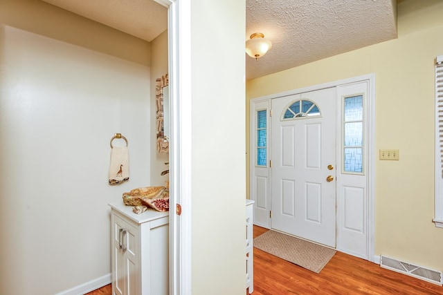 17031 Sedona Dr, Abingdon, VA 24211 - entryway with light wood-style floors and a textured ceiling