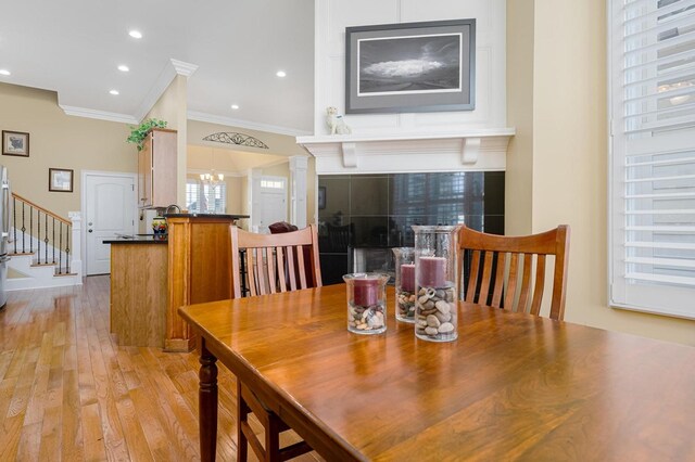 20324 Josh Allen Dr, Abingdon, VA 24211 - dining area with ornamental molding, stairs, light wood-style floors, a chandelier, and recessed lighting