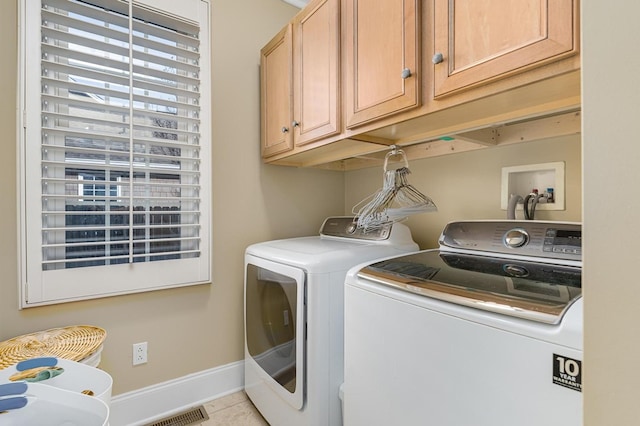 20324 Josh Allen Dr, Abingdon, VA 24211 - laundry area with washer and clothes dryer, cabinet space, and light tile patterned floors