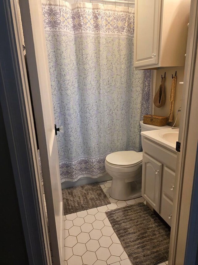 1317 Newton St, Bristol, VA 24201 - full bathroom with vanity, tile patterned floors, and a shower with curtain