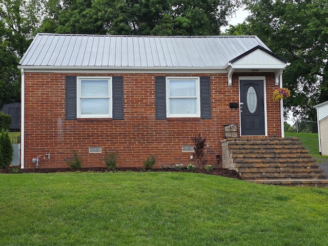 1317 Newton St, Bristol, VA 24201 - ranch-style house featuring a front lawn, brick siding, a metal roof, and crawl space