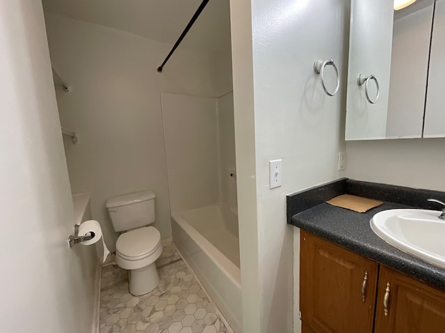 bathroom featuring toilet, vanity, and tile patterned flooring