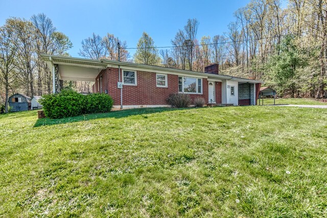 324 Mill Creek Rd, Chilhowie, VA 24319 - ranch-style house featuring a front yard, a chimney, and brick siding