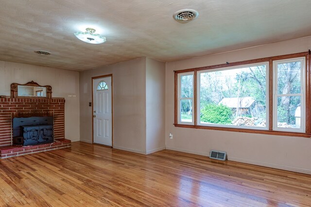324 Mill Creek Rd, Chilhowie, VA 24319 - unfurnished living room featuring baseboards, visible vents, and light wood finished floors