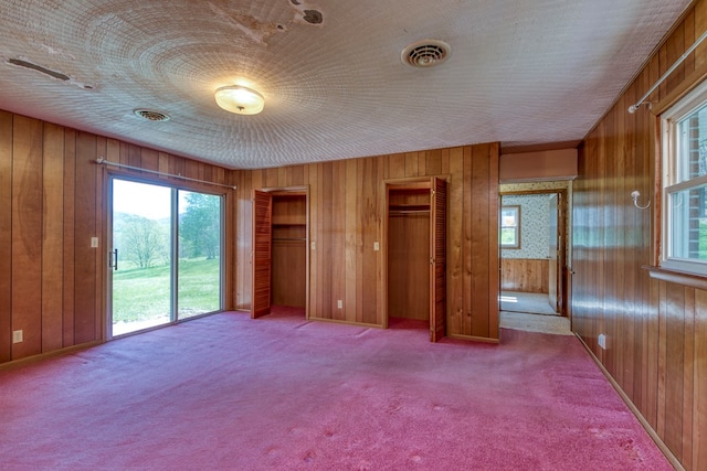 324 Mill Creek Rd, Chilhowie, VA 24319 - unfurnished bedroom featuring wood walls, access to outside, and carpet