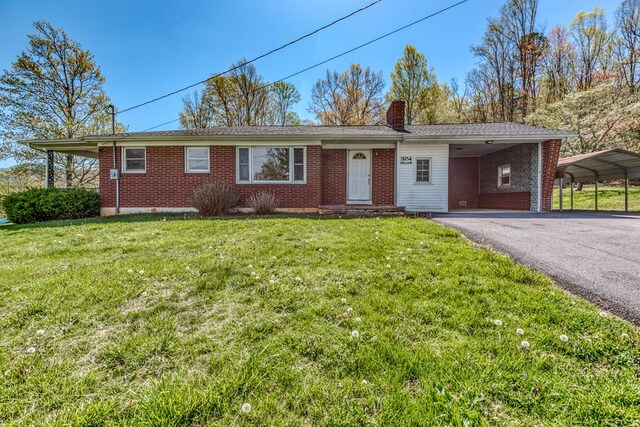 324 Mill Creek Rd, Chilhowie, VA 24319 - ranch-style house with a front yard, a chimney, brick siding, and aphalt driveway