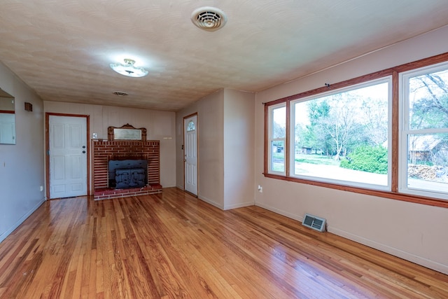 324 Mill Creek Rd, Chilhowie, VA 24319 - unfurnished living room with light wood-type flooring, visible vents, and baseboards