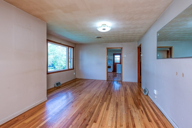 324 Mill Creek Rd, Chilhowie, VA 24319 - empty room with baseboards, visible vents, and light wood-style flooring