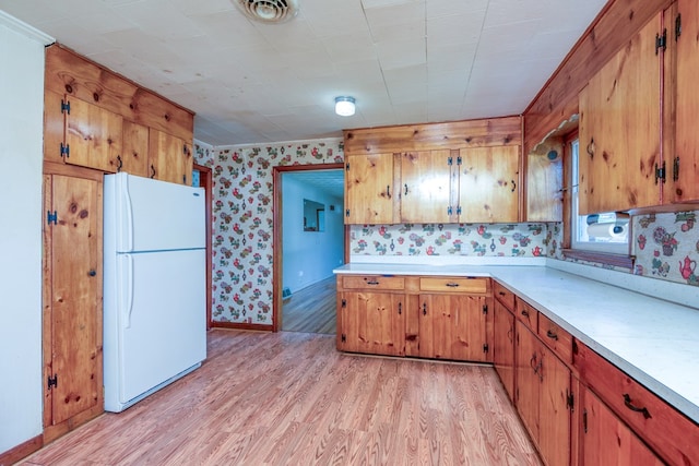 324 Mill Creek Rd, Chilhowie, VA 24319 - kitchen featuring freestanding refrigerator, wallpapered walls, light countertops, light wood finished floors, and visible vents