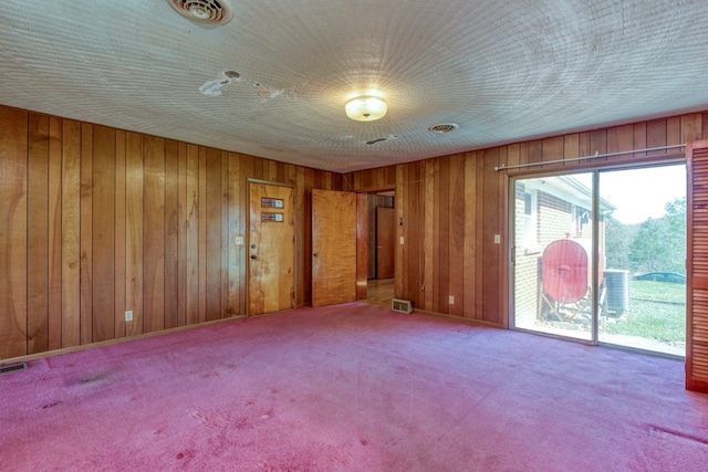 324 Mill Creek Rd, Chilhowie, VA 24319 - empty room with wooden walls, visible vents, and carpet
