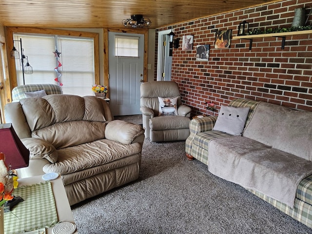carpeted living area with wooden ceiling and brick wall