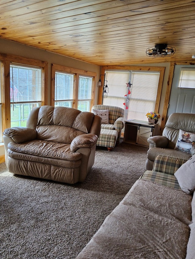 living area featuring wood ceiling and carpet