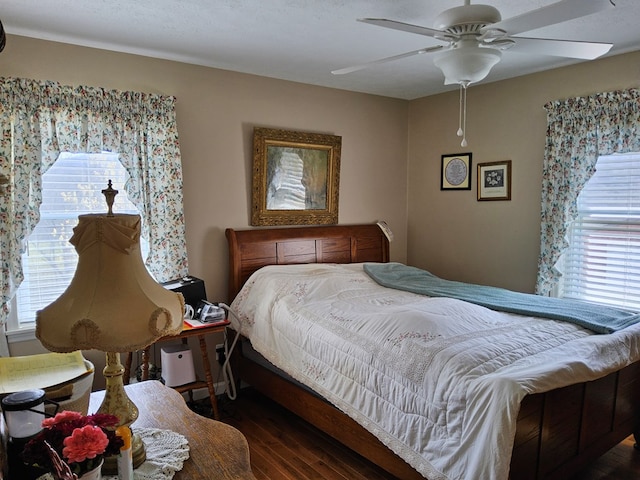 bedroom featuring wood finished floors and a ceiling fan