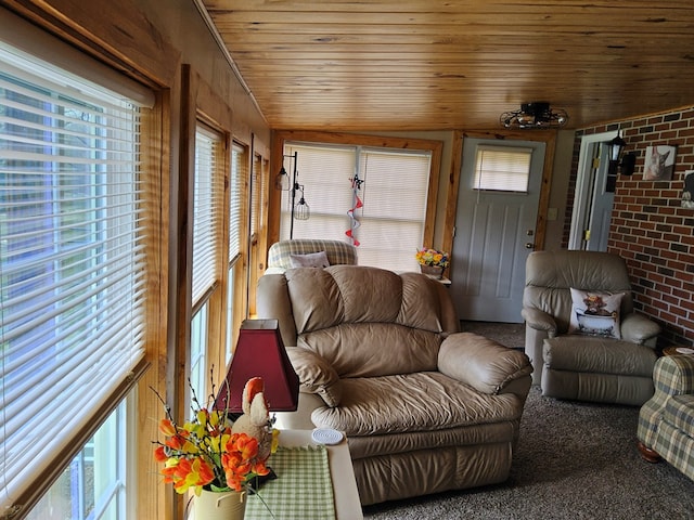 living room with wooden ceiling and brick wall