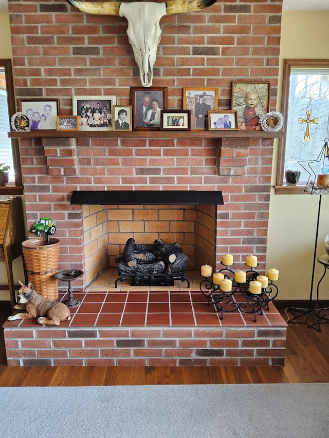 interior details with a fireplace and wood finished floors