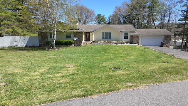 ranch-style house featuring a front lawn, aphalt driveway, stone siding, fence, and a garage