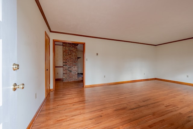 empty room featuring baseboards and light wood-style floors