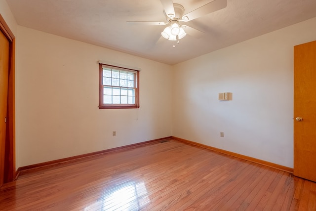 unfurnished room with light wood-style flooring, baseboards, and ceiling fan