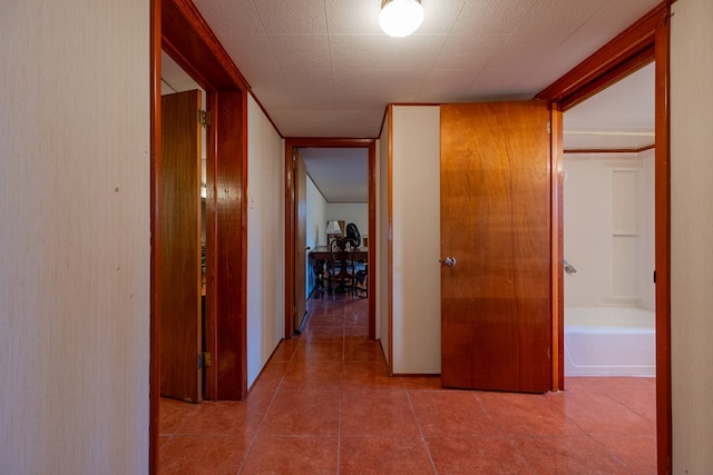 corridor with light tile patterned floors