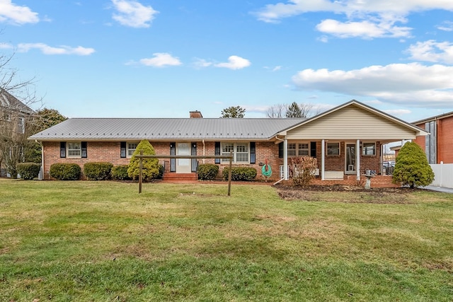 single story home with a front yard, brick siding, and covered porch