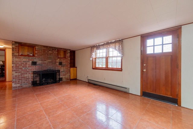 unfurnished living room with a brick fireplace, light tile patterned floors, and baseboard heating