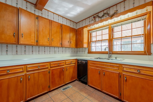 kitchen featuring visible vents, a sink, wallpapered walls, black dishwasher, and light countertops